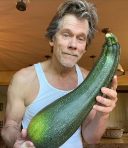 Kevin Bacon with one of Farmer Jenn's squashes.